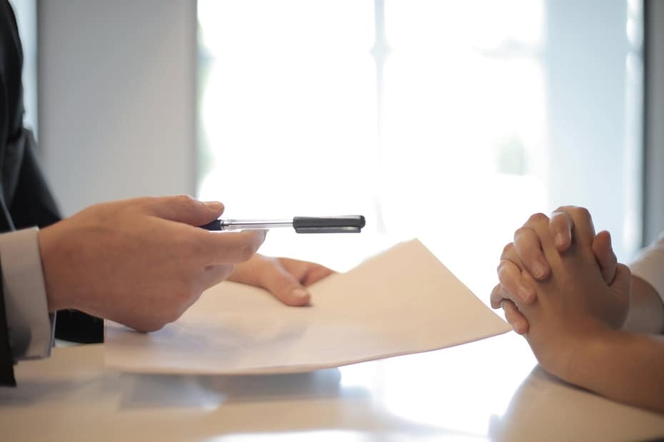 crop businessman giving contract to woman to sign